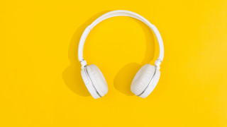 White headphones yellow background shadow - product photo free wallpaper
