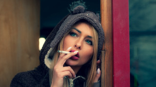 Woman hoodie smoking window portrait - her mouth free wallpaper