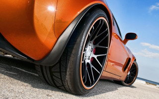 Car tire ocean sky clouds - a close up of a car tire free wallpaper