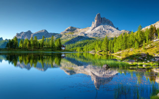 Mountain range reflection lake boat - tree and mountains free wallpaper