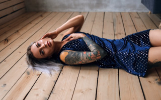 Tattooed woman blue dress brick - figurative art free wallpaper