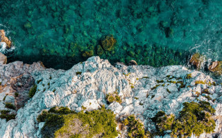 Rocky beach water boat nature - a view free wallpaper