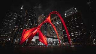 Red sculpture cityscape night sky - skyscraper free wallpaper