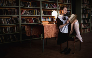 Woman sitting reading library lamp - a lamp free wallpaper