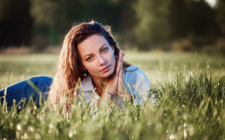 Woman laying in grass serious - serious free wallpaper for desktop