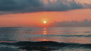 Sunset ocean boat clouds island - a small island in the distance free wallpaper