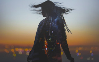 Woman blowing hair city sunset - the sun setting free wallpaper