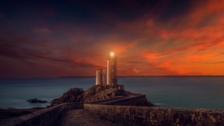 Lighthouse rocky cliff sunset red - a rocky cliff free wallpaper