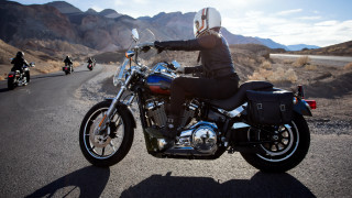 Man riding motorcycle mountains sky - a road next free wallpaper