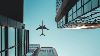 Cityscape plane architecture sky fence - over a city free wallpaper