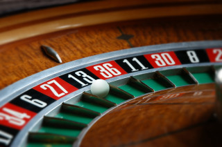 Roulette ball center blurry background - number free wallpaper