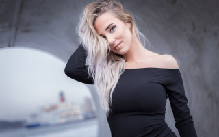 Blonde woman black dress mirror - a building in the background free wallpaper