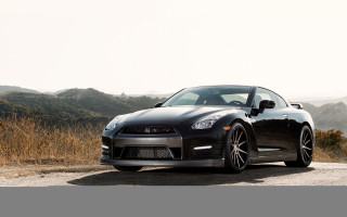 Black sports car mountain road 3 - a grassy area free wallpaper