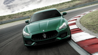 Green maserati driving cloudy sky - a track free wallpaper
