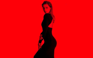 Woman black dress red background - a red background behind her free wallpaper