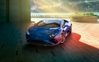 Blue sports car cityscape render - a city skyline in the background free wallpaper