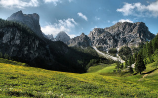 Grassy field mountain clouds road - a grassy field free wallpaper