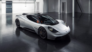 Silver sports car garage black 2 - a white wall behind free wallpaper