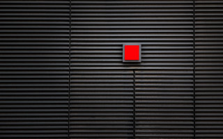 Red light switch black wall - vertical free wallpaper