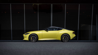 Yellow sports car glass building 4 - side profile free wallpaper