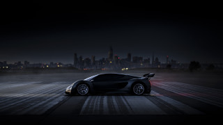 Black sports car night city 6 - a city skyline in the background free wallpaper