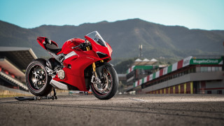 Red motorcycle mountain road building - a red motorcycle free wallpaper