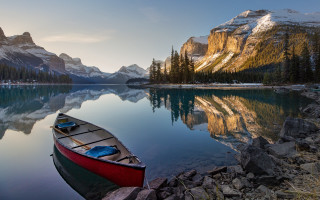 Canoe mountain lake rocks sky - a canoe free wallpaper