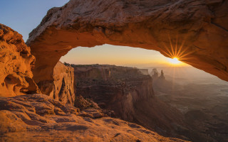 Sunset arch rock formation orange - a sun free wallpaper