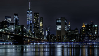 City skyline bridge river night 44 - the water and a bridge in the foreground free wallpaper
