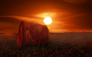 Hay bale sunset clouds mountain - great composition free wallpaper