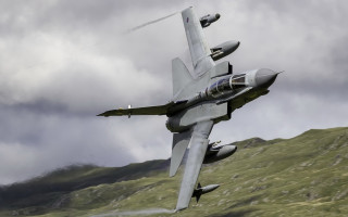 Fighter jet green hills clouds - a fighter free wallpaper for desktop
