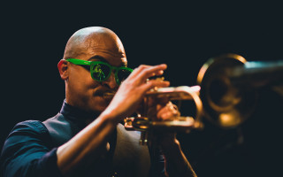 Man sunglasses trumpet dark room - a trumpet free wallpaper