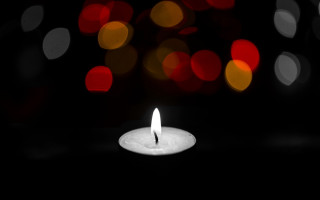 Candle lit dark blurry lights - a candle free wallpaper