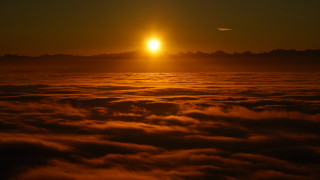Sunset clouds mountains ocean reflection - sunrise free wallpaper