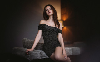Elegant woman black dress couch - a lamp free wallpaper