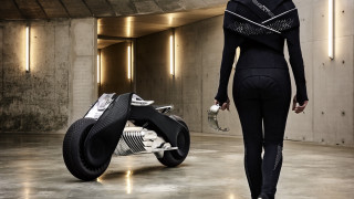 Woman black outfit walking motorcycle - tech wear free wallpaper