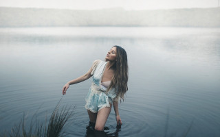 Woman water holding stick outdoors - her mouth free wallpaper