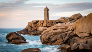 Lighthouse rocky shore cinematic mountains - a rocky shore free wallpaper