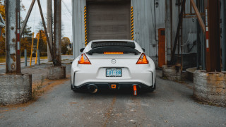 White car garage door open - the back of the car free wallpaper