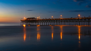Pier night lights reflection building - a pier free wallpaper