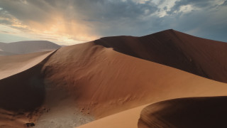 Sand dune clouds trees desert - a large sand dune free wallpaper