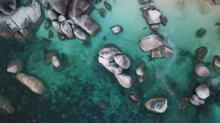 Water rocks boat starry sky - a view of a body free wallpaper