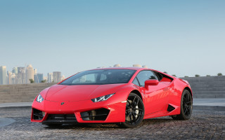 Red sports car cobblestone city 2 - a city skyline free wallpaper