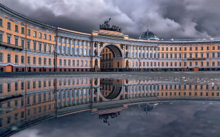 Large building circular entrance clock - perfect symmetry free wallpaper