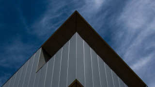 Building triangular roof blue sky - the background and a plane free wallpaper