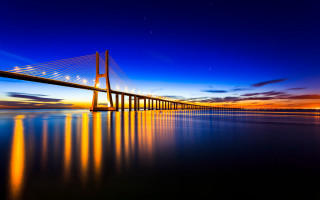 Long bridge sunset water reflection - almada negreiro free wallpaper
