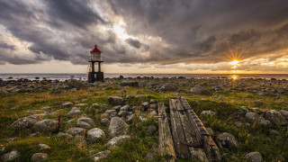 Lighthouse rocky shore cloudy sky 2 - a rocky shore free wallpaper