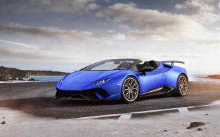Blue sports car ocean cloudy 2 - a road near the ocean free wallpaper