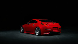 Red sports car dark room 25 - rim free wallpaper