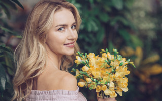 Woman yellow flowers smiling outdoors - anna maria barbara abesch free wallpaper